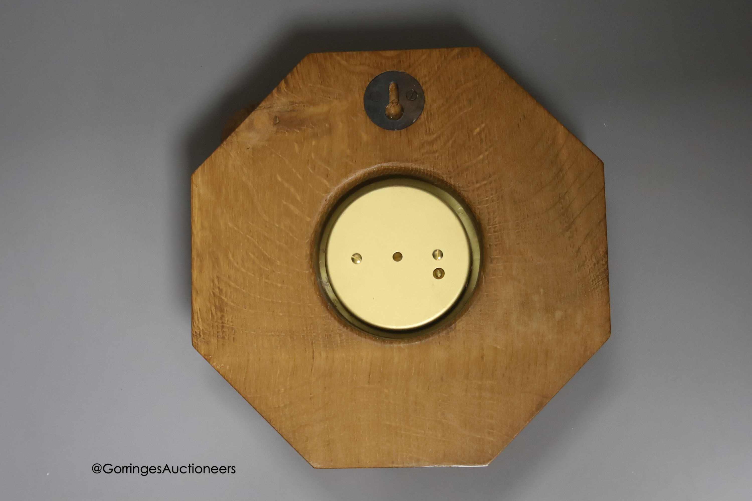 A Mouseman octagonal oak aneroid barometer, 21cm
